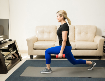 woman performing lunges at home pw1